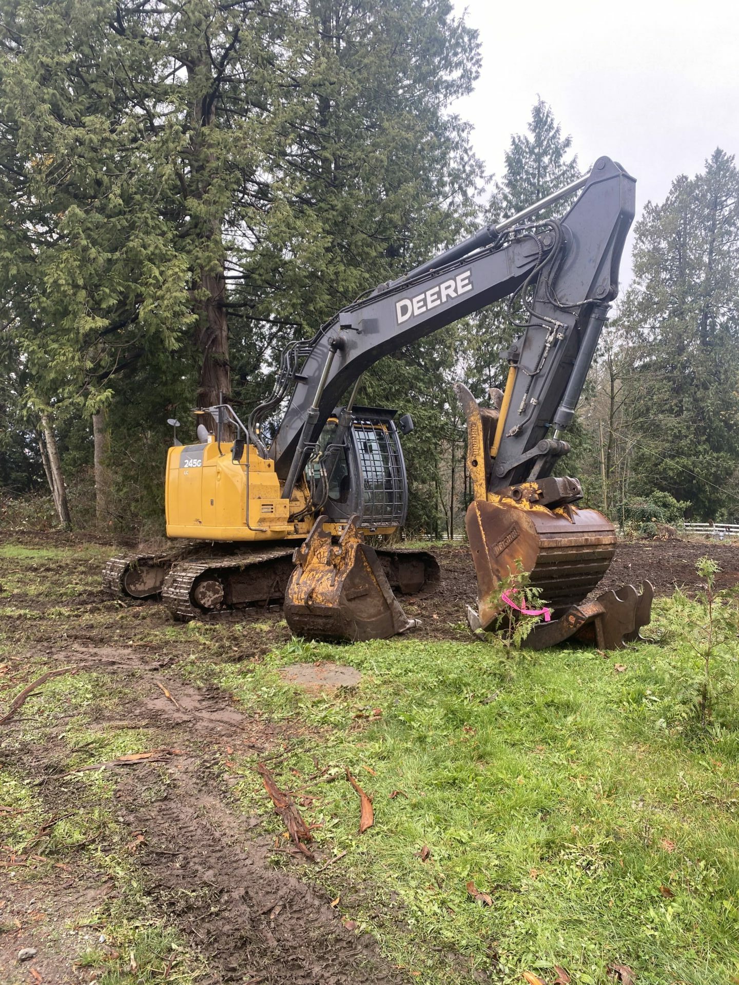 Contact Resources John Deere excavator in a field